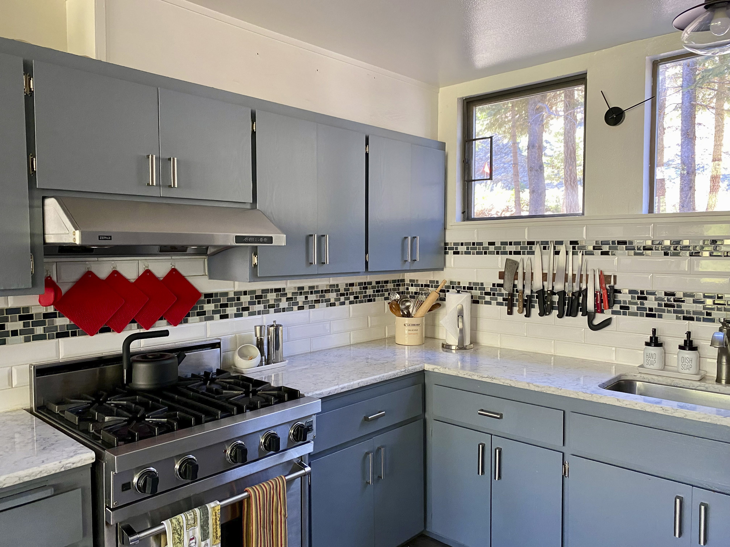 a modern kitchen with stainless appliances