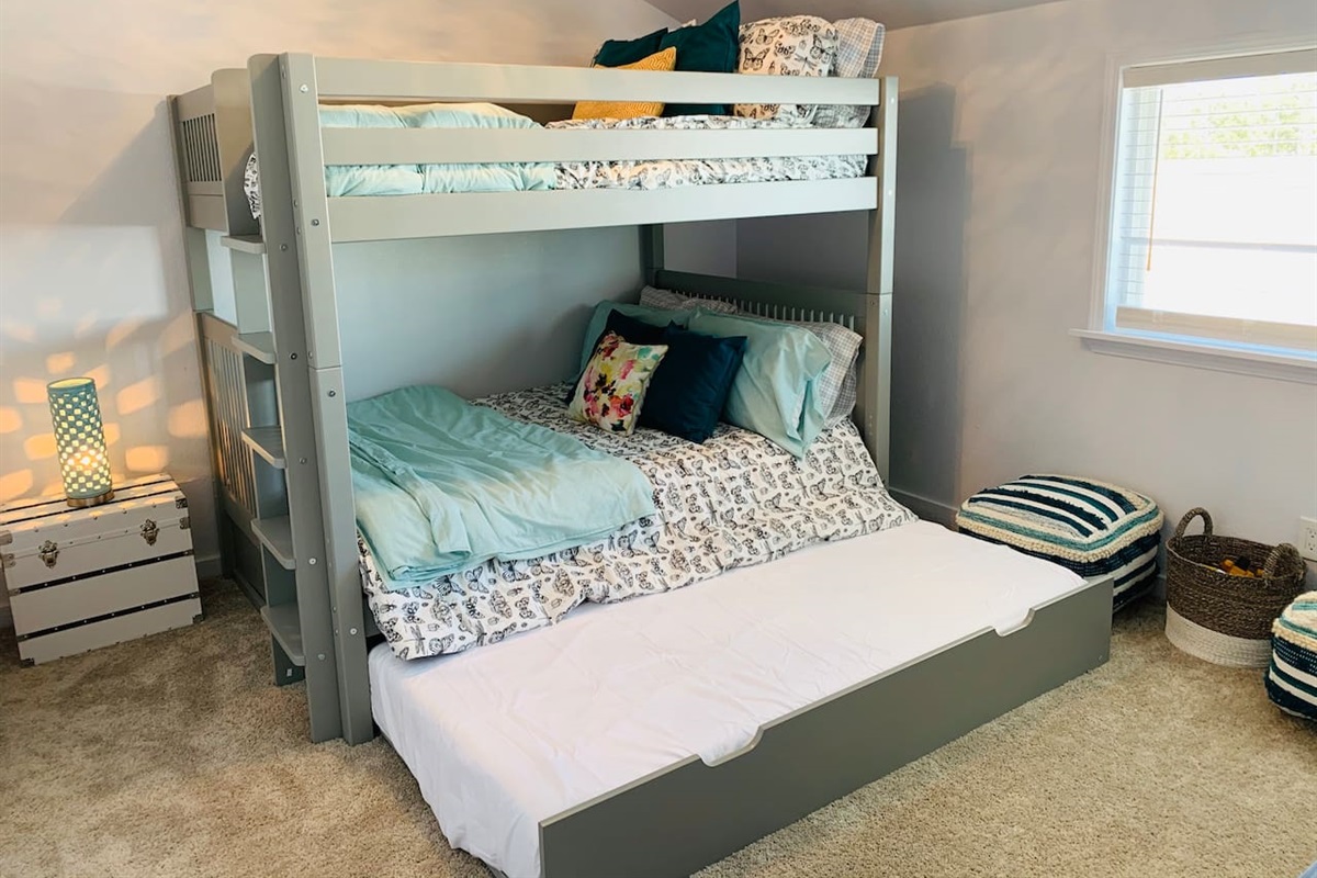 This room alone sleeps 5 people on this bunk bed that holds 2 full beds and 1 (pullout) twin